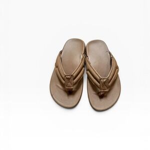 Tan leather flip flops with a classic design